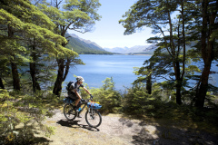 Dallas Hewett rides the trail around South Mavora Lake, Southland, New Zealand.