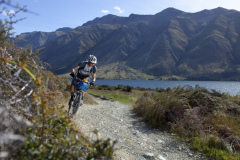 Dallas Hewett biking north on the eastern side of the Mavora Lakes, Southland, New Zealand.