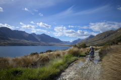 Dallas Hewett biking north on the eastern side of the Mavora Lakes, Southland, New Zealand.