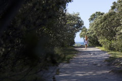 Kristin Crook soaks in the early summer sunshine at Main Beach, Mount Maunganui, Bay of Plenty, New Zealand.