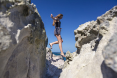 Kristin Crook soaks in the early summer sunshine at Main Beach, Mount Maunganui, Bay of Plenty, New Zealand.