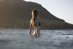 Kristin Crook soaks in the early summer sunshine during a swim at Main Beach, Mount Maunganui, Bay of Plenty, New Zealand.