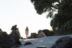 Kristin Crook relaxes in the sunshine at the beach, Mount Maunganui, Bay of Plenty, New Zealand.