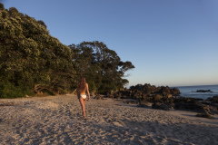 Kristin Crook relaxes in the sunshine at the beach, Mount Maunganui, Bay of Plenty, New Zealand.