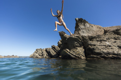 Kristin Crook relaxes in the sunshine at the beach, Mount Maunganui, Bay of Plenty, New Zealand.