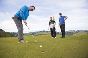 Delegates enjoy a round of golf between conference sessions at Chisolm Park Golf Course, St Kilda Beach, Dunedin, New Zealand.