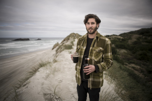 Bart Acres, of Velvet Worm Brewery, with an experimental stout at Smaills Beach ahead of the Dunedin Craft Beer and Food Festival held at Forsyth Barr Stadium, Dunedin, New Zealand.