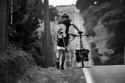 Musician Monty Bevins ahead of his nationwide cycle tour of New Zealand on the road to Blackhead Beach, Dunedin, New Zealand.