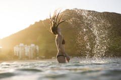 Skinnies ambassador Kristin Crook soaks in the early summer sunshine at Main Beach, Mount Maunganui, Bay of Plenty, New Zealand.