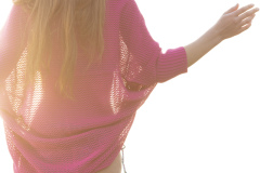 A woman wears a cardigan from the summer campaign for Hello Friday, Dunedin, New Zealand.