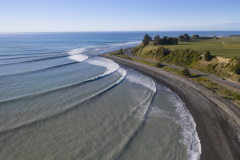 Waves wrap around State Highway 1 and the railway line near Kaikoura, New Zealand. Photo: Derek Morrison