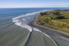 Waves wrap around State Highway 1 and the railway line near Kaikoura, New Zealand. Photo: Derek Morrison